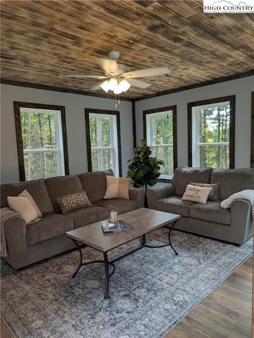 a living room with furniture and windows