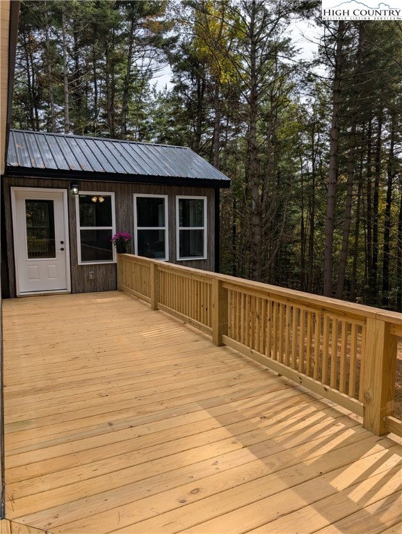 222 Doell Lane Sparta, NC 28675 - Photo 19 of 23 a view of a house with a wooden deck