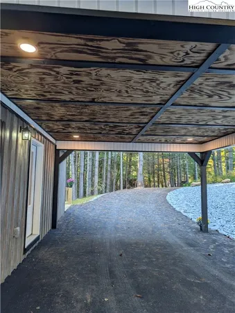 a view of an empty room with a fireplace