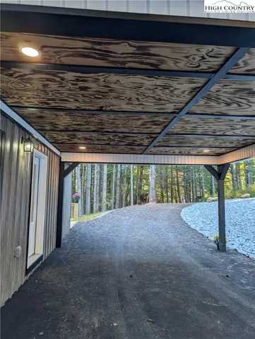a view of an empty room with a fireplace
