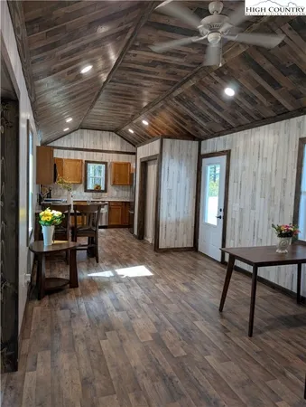a view of a room with furniture window and wooden floor
