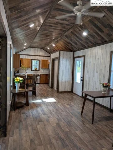 a view of a room with furniture window and wooden floor