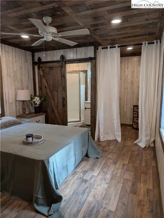 a bathroom with a sink a mirror and shower