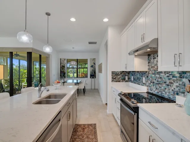 a kitchen with a stove and a sink