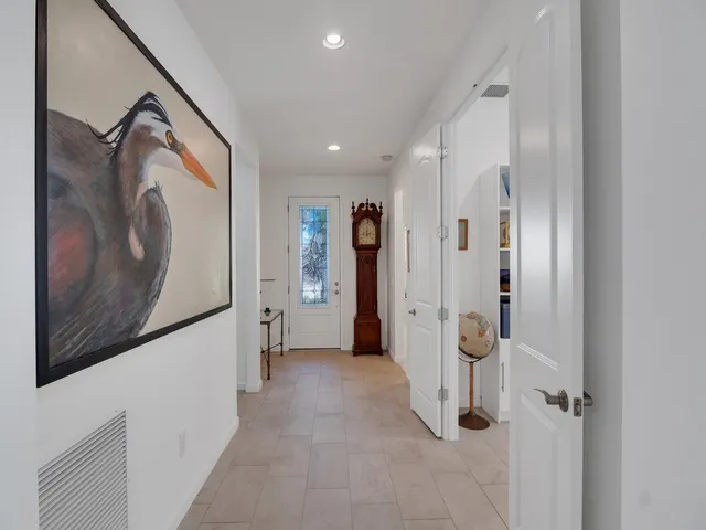 a view of a hallway with wooden shelves