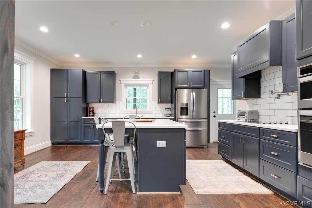 17137 Old Ridge Road Montpelier, VA 23192 - Photo 17 of 49 a kitchen with kitchen island granite countertop wooden floors and view living room