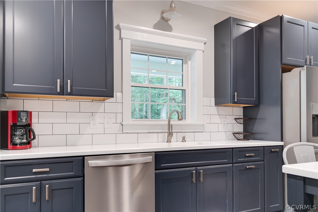 17137 Old Ridge Road Montpelier, VA 23192 - Photo 19 of 49 a kitchen with stainless steel appliances a sink cabinets and a window