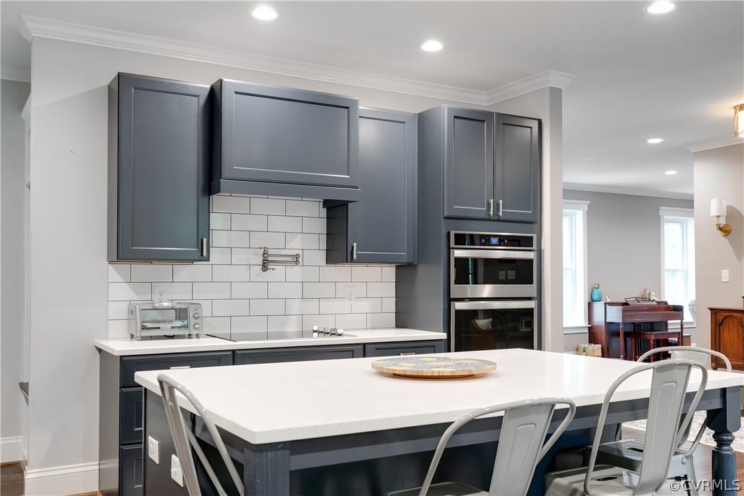 17137 Old Ridge Road Montpelier, VA 23192 - Photo 20 of 49 a kitchen with a table chairs and a refrigerator