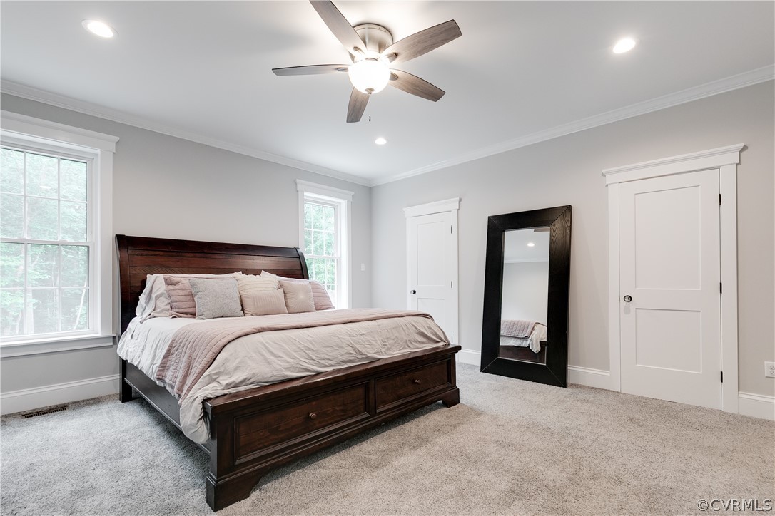 17137 Old Ridge Road Montpelier, VA 23192 - Photo 37 of 49 a spacious bedroom with a bed and a ceiling fan
