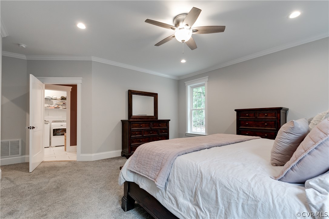17137 Old Ridge Road Montpelier, VA 23192 - Photo 40 of 49 a spacious bedroom with a bed and a chandelier