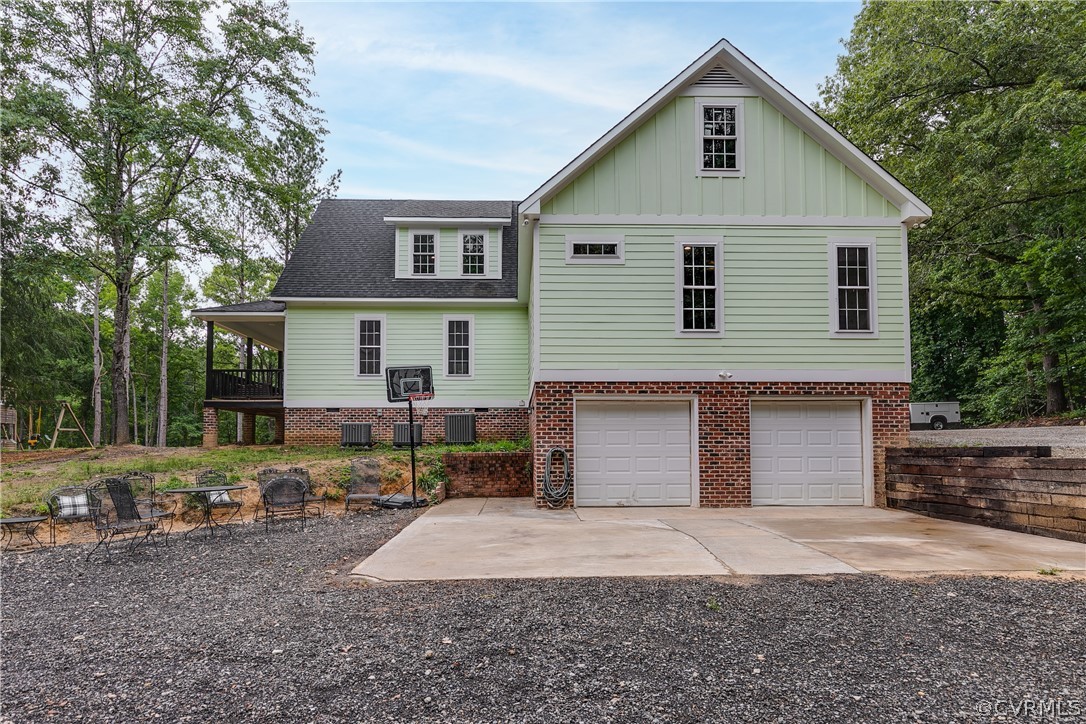 17137 Old Ridge Road Montpelier, VA 23192 - Photo 46 of 49 a front view of a house with a yard and garage