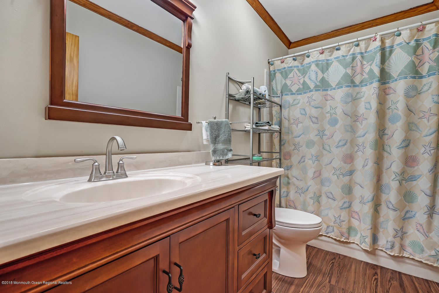 31 Frank Applegate Road Jackson, NJ 08527 - Photo 34 of 36 a bathroom with a granite countertop sink a toilet and a mirror