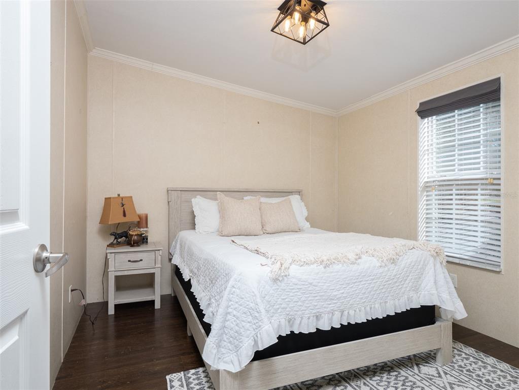 2900 Northwest 68th Avenue Ocala, FL 34482 - Photo 12 of 27 a bedroom with a bed and a table