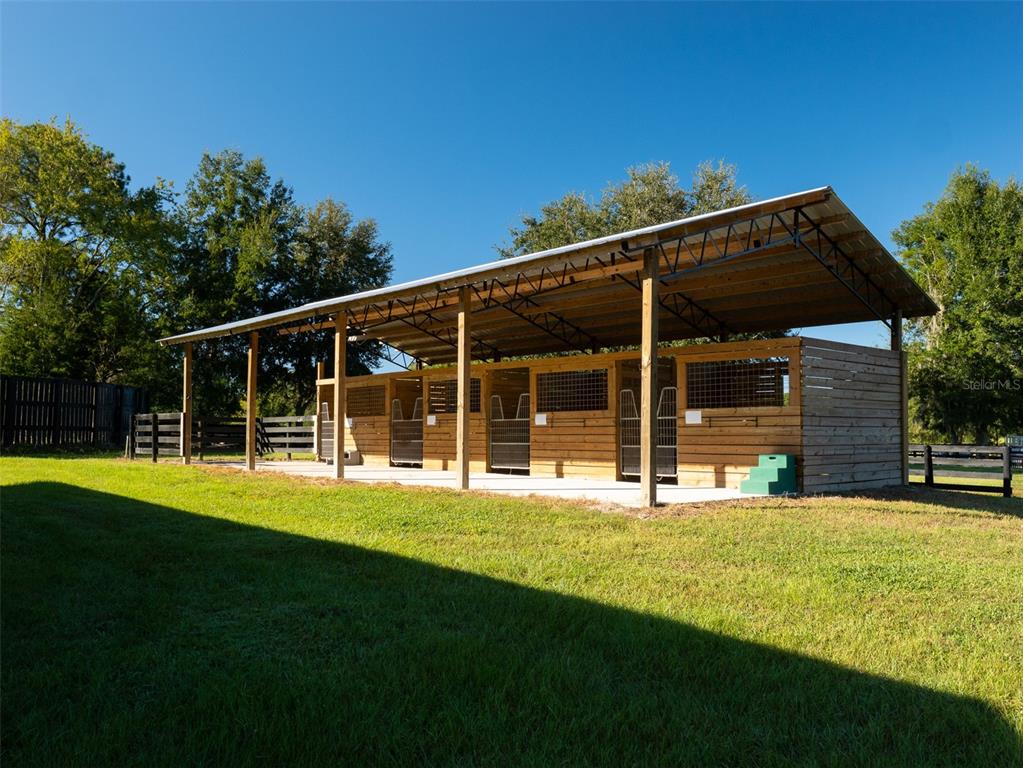 2900 Northwest 68th Avenue Ocala, FL 34482 - Photo 21 of 27 a view of a house with a yard