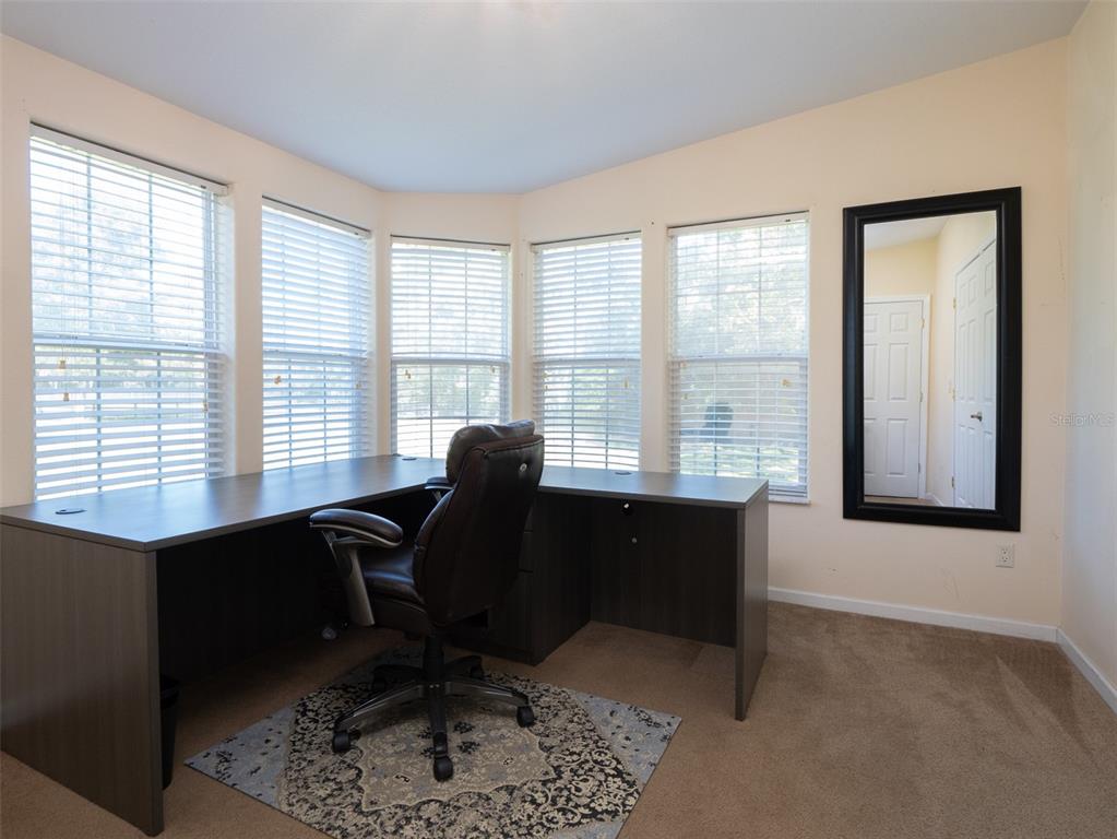 2900 Northwest 68th Avenue Ocala, FL 34482 - Photo 9 of 27 a view of a workspace with furniture and a window