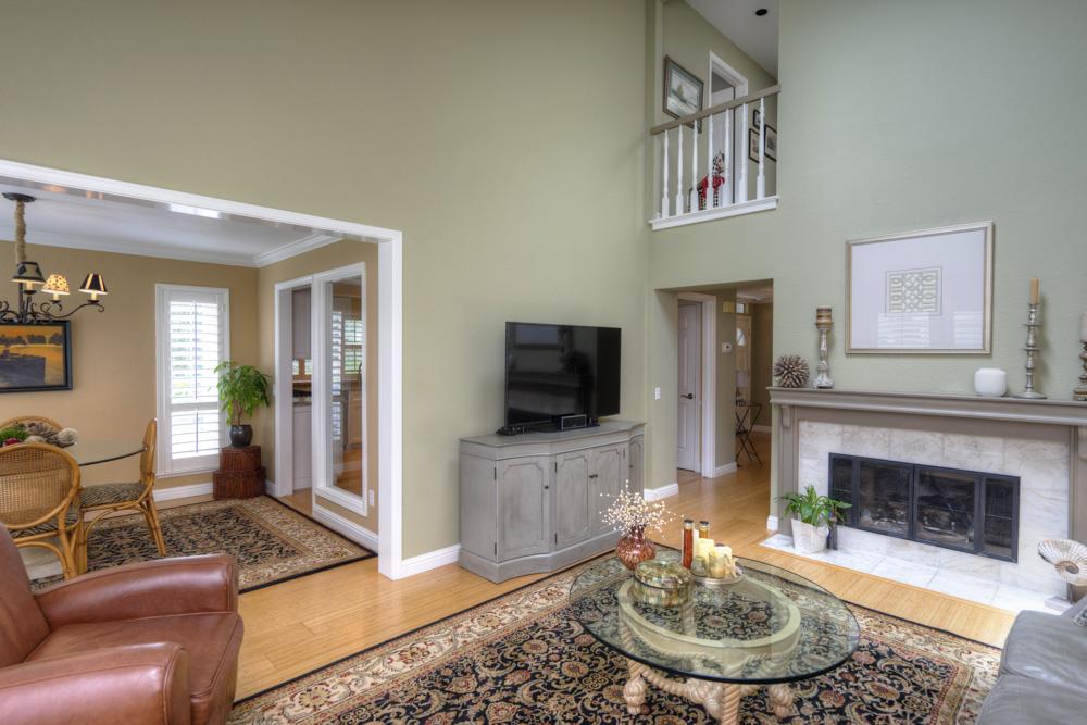 2 Merion Road Half Moon Bay, CA 94019 - Photo 7 of 20 a living room with furniture a flat screen tv and a fireplace