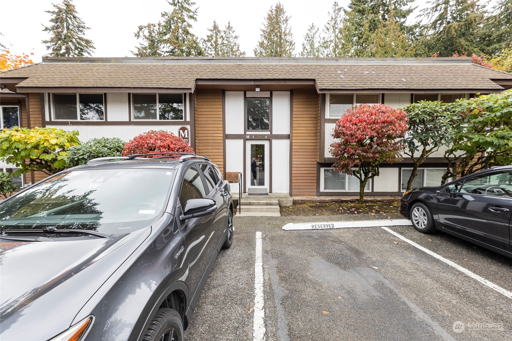 7205 224th Street Southwest, Unit M4 Edmonds, WA 98026 - Photo 1 of 1 a view of a car park in front of a house
