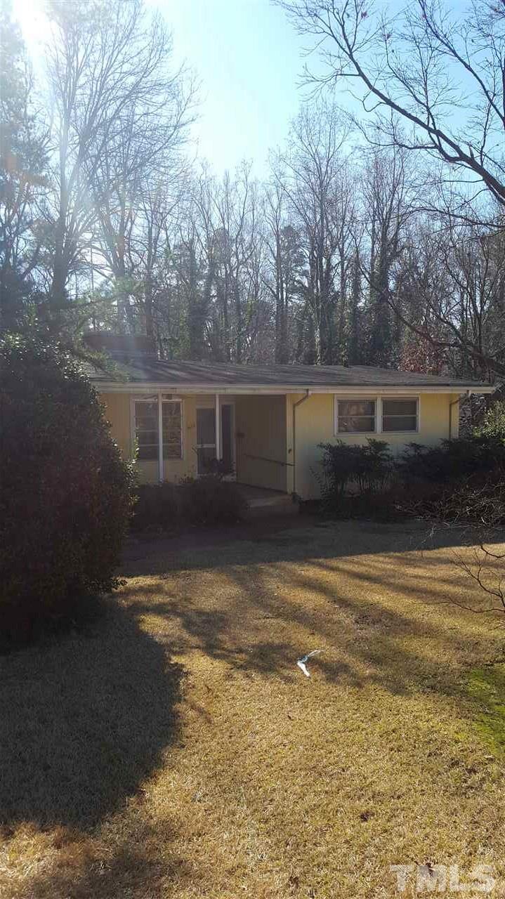 2617 Wells Avenue Raleigh, NC 27608 - Photo 1 of 7 a view of pool with trees in the background