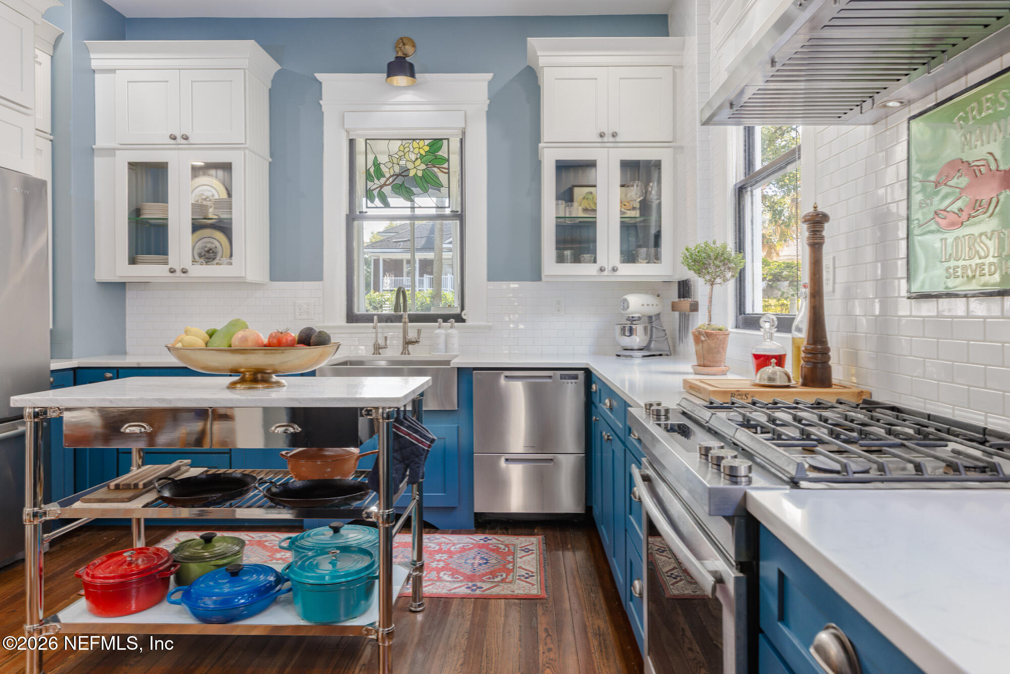 2326 Forbes Street Jacksonville, FL 32204 - Photo 19 of 55 a kitchen with stainless steel appliances granite countertop a stove a sink and a microwave
