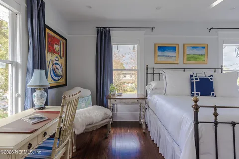 a view of a living room with a window and chandelier