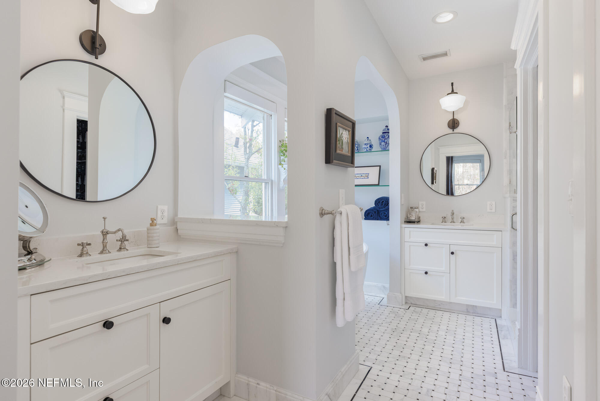 2326 Forbes Street Jacksonville, FL 32204 - Photo 35 of 55 a bathroom with a toilet a sink a mirror and vanity