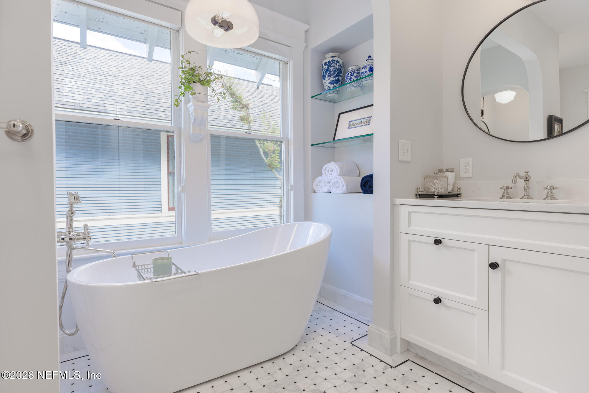 2326 Forbes Street Jacksonville, FL 32204 - Photo 36 of 55 a white bath tub sitting next to a bathroom sink
