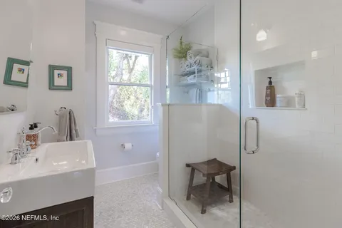 a view of a dry yard with trees