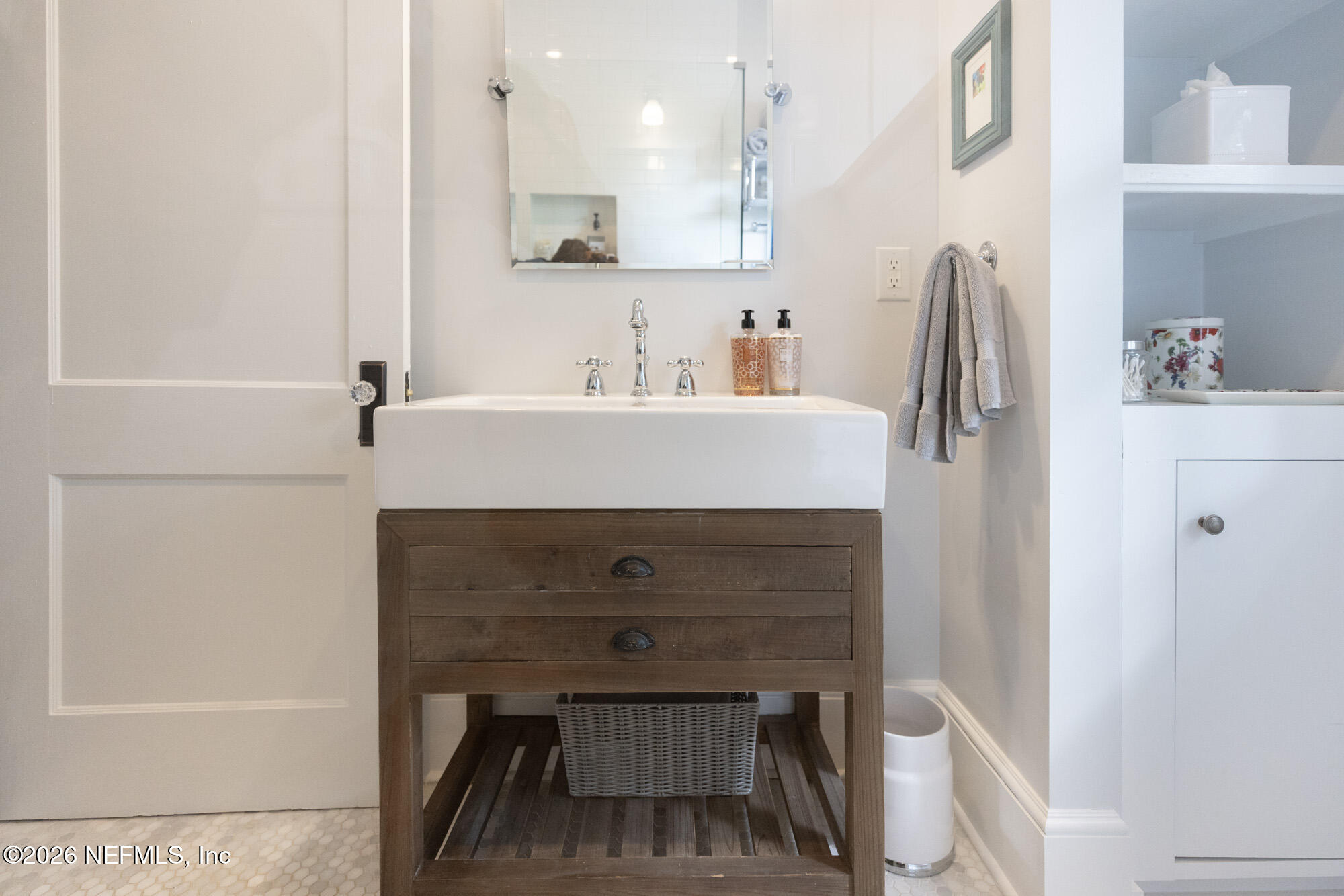 2326 Forbes Street Jacksonville, FL 32204 - Photo 44 of 55 a bathroom with a sink a mirror and a shower