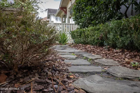 a backyard of a house with lots of green space