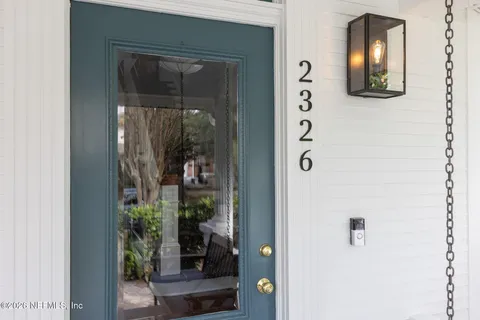 a view of a house with a tree