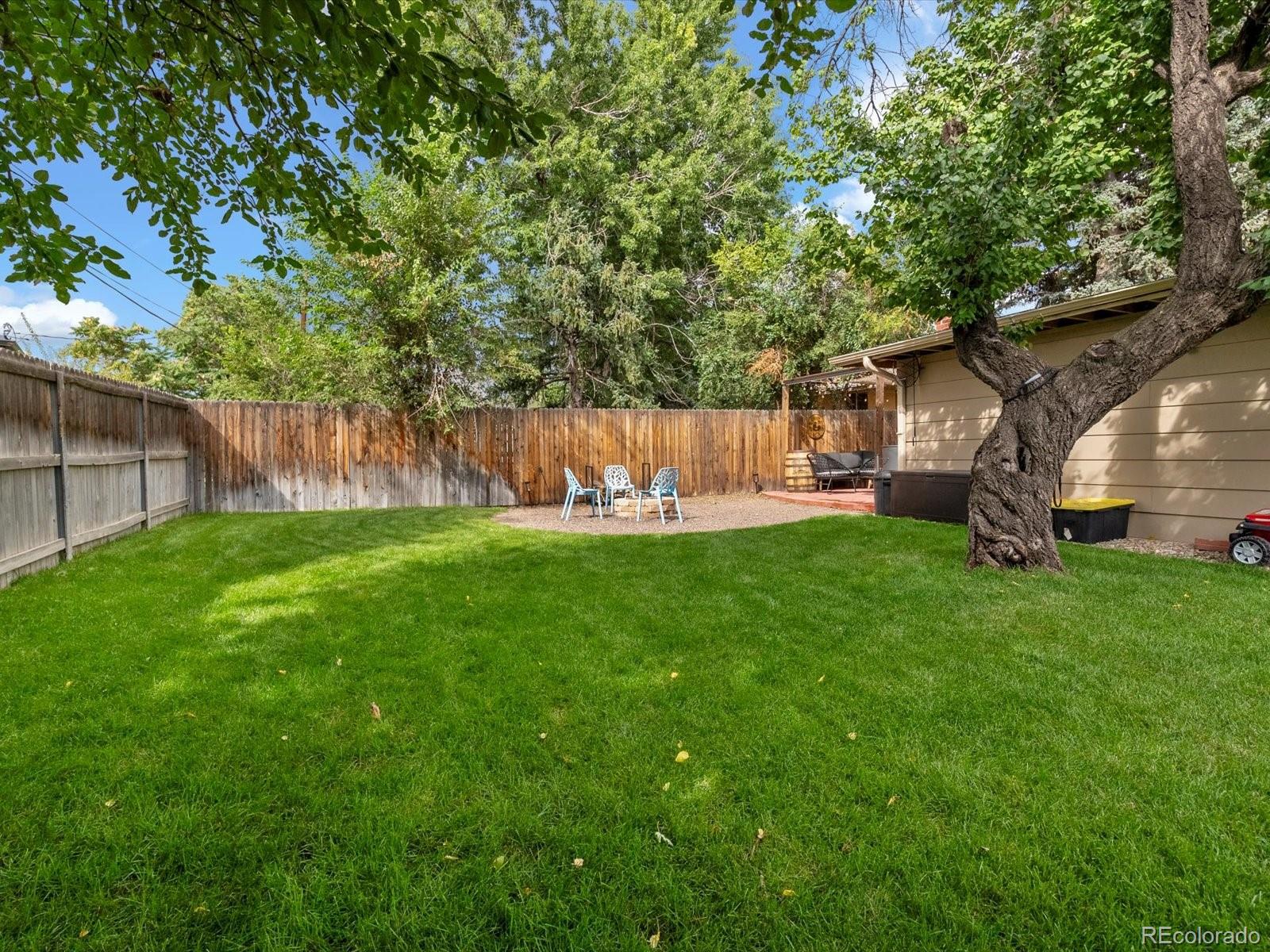 4963 North Harlan Street Wheat Ridge, CO 80033 - Photo 38 of 42 a view of yard with swimming pool and green space