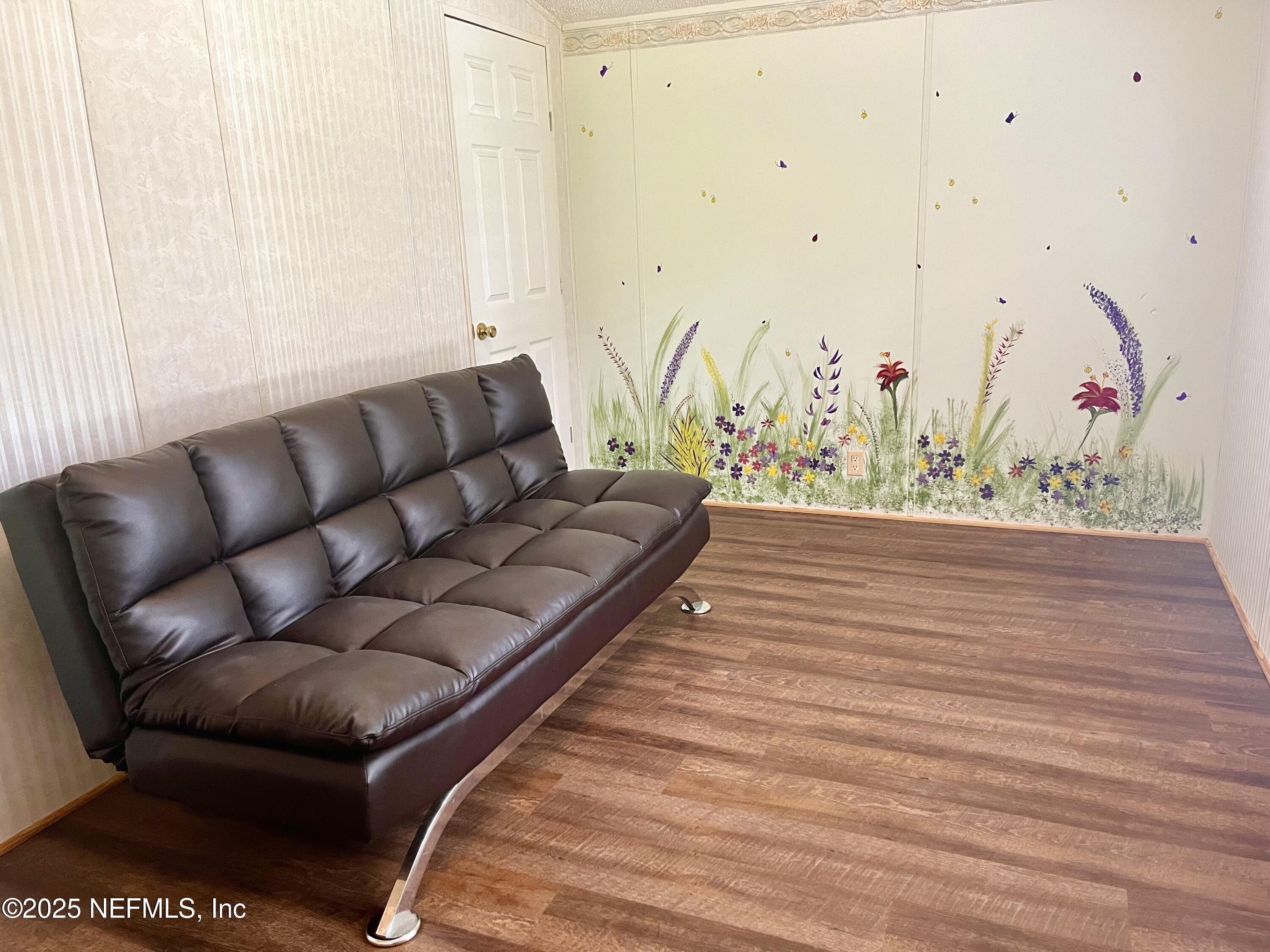 118 July Avenue Georgetown, FL 32139 - Photo 11 of 21 a living room with a couch