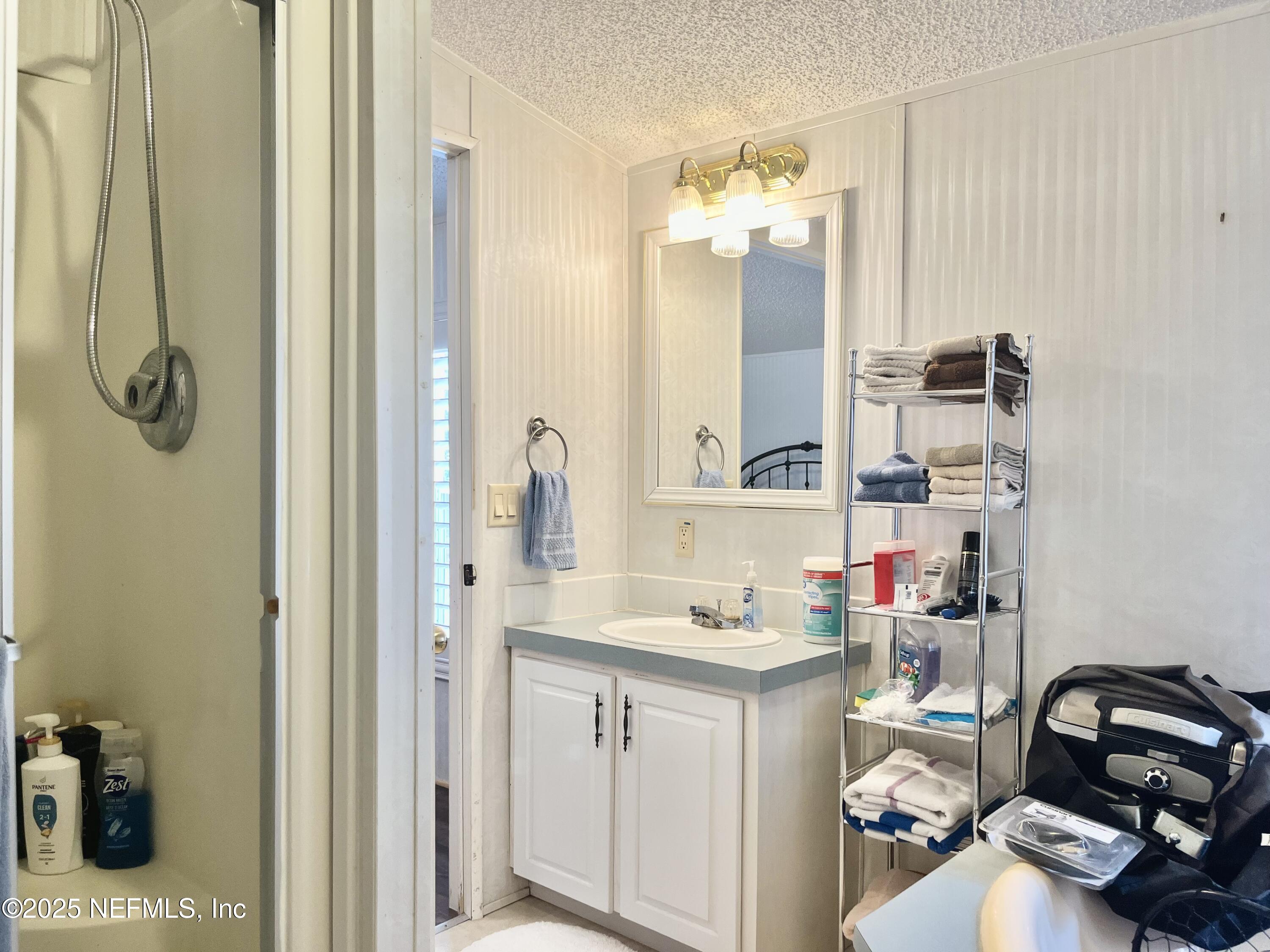 118 July Avenue Georgetown, FL 32139 - Photo 12 of 21 a bathroom with a sink and a mirror