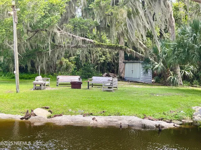 a garden view with a lake view