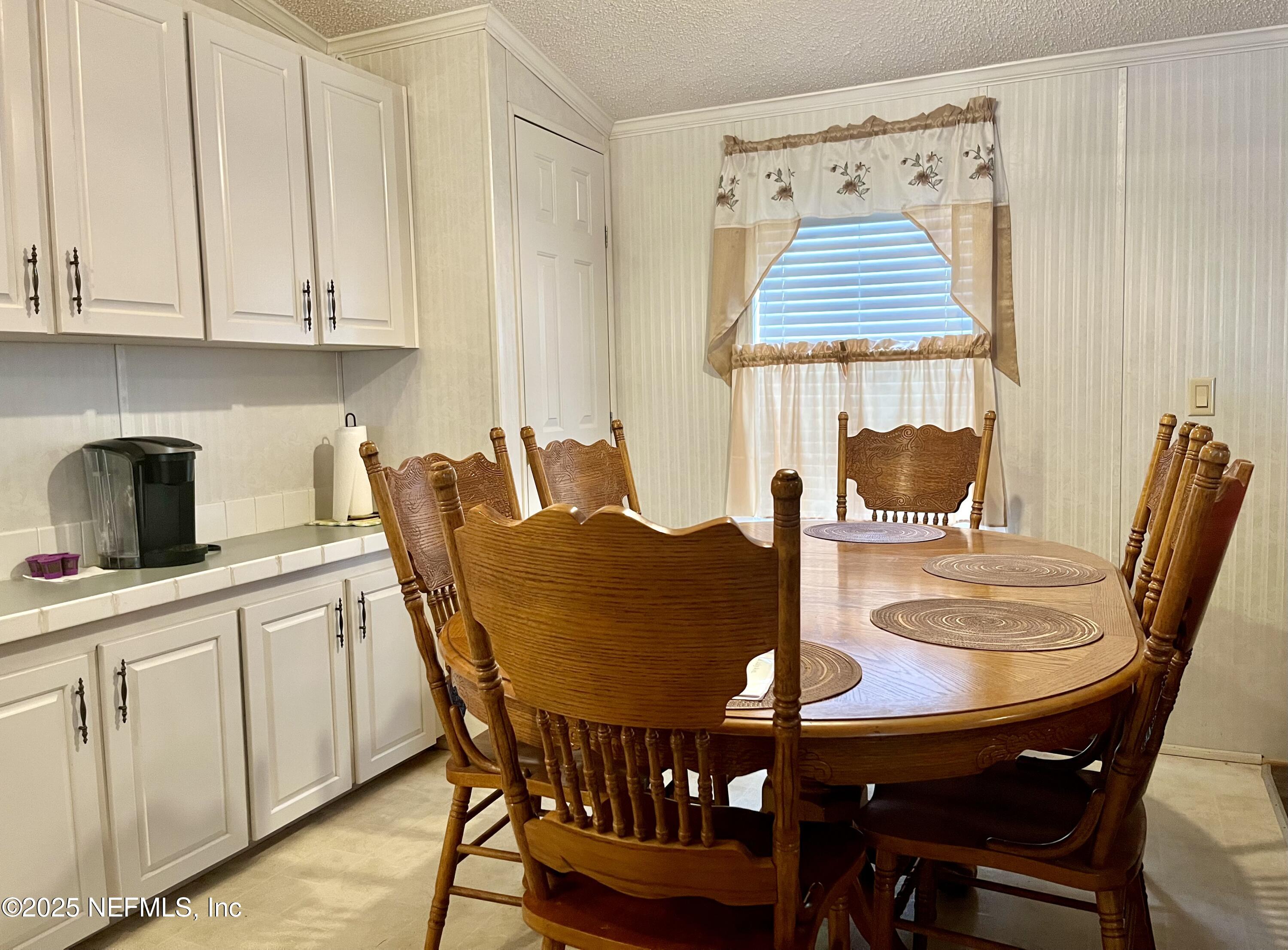 118 July Avenue Georgetown, FL 32139 - Photo 8 of 21 a dining room with furniture and window