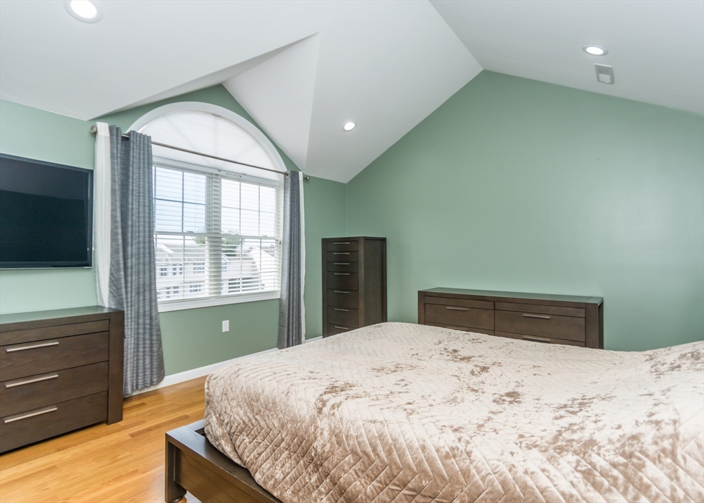 985 Trapelo Road, Unit 23 Waltham, MA 02452 - Photo 18 of 27 a bedroom with a bed and a window