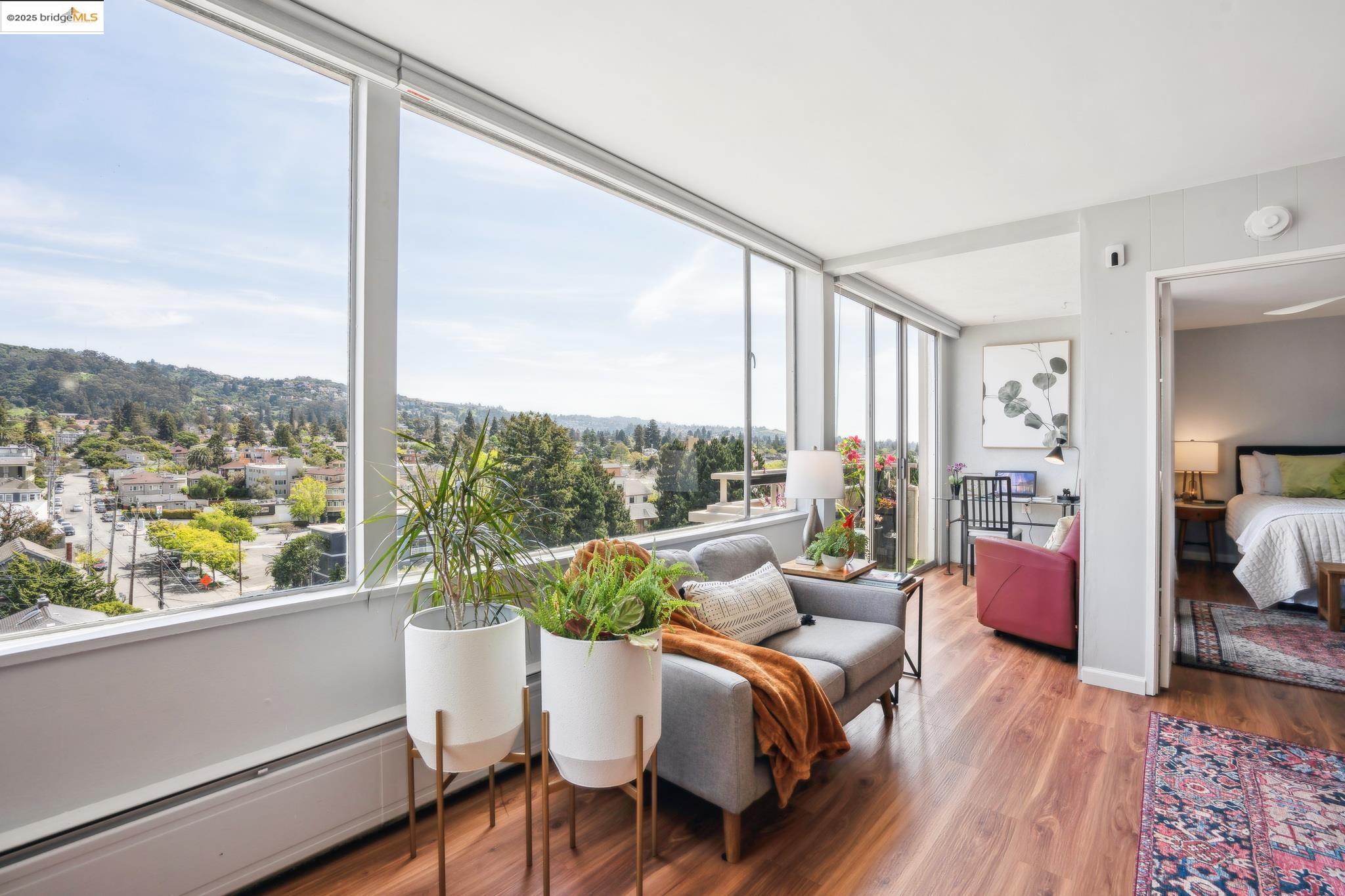 2550 Dana Street, Unit 9B Berkeley, CA 94704 - Photo 1 of 1 a living room with furniture and a large window