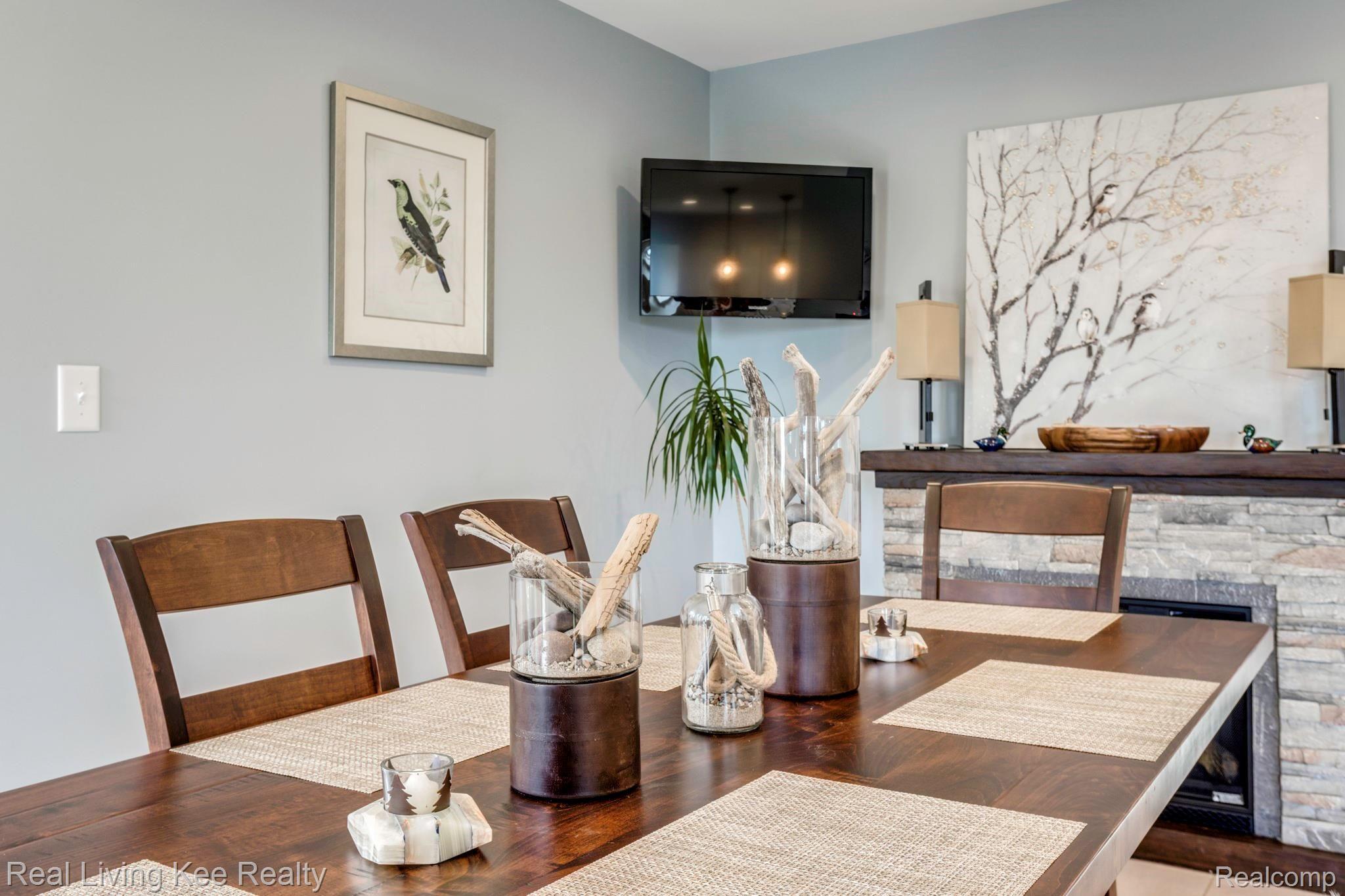 5775 McIntyre Road North Street, MI 48049 - Photo 17 of 65 5775 McIntyre Rd. close up of eating area showing electric fireplace_which is furniture.JPG