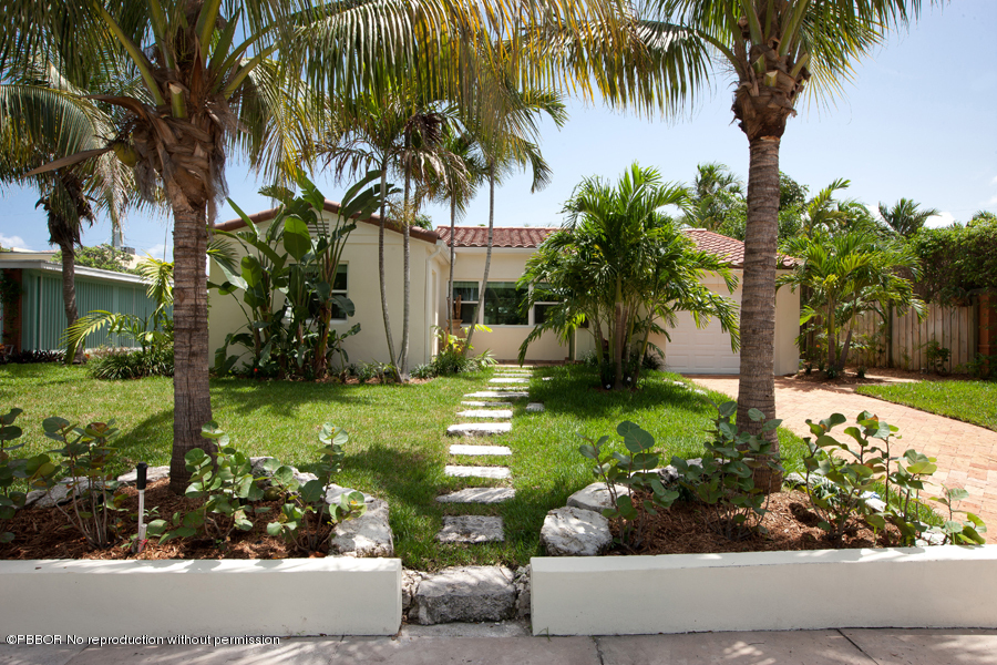 130 Alpine Road West Palm Beach, FL 33405 - Photo 1 of 14 a front view of a house with garden