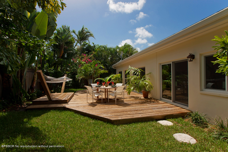 130 Alpine Road West Palm Beach, FL 33405 - Photo 14 of 14 a view of a house with backyard sitting area and garden