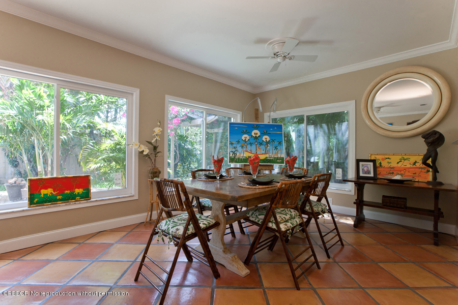 130 Alpine Road West Palm Beach, FL 33405 - Photo 3 of 14 a view of a dining room with furniture and a large window
