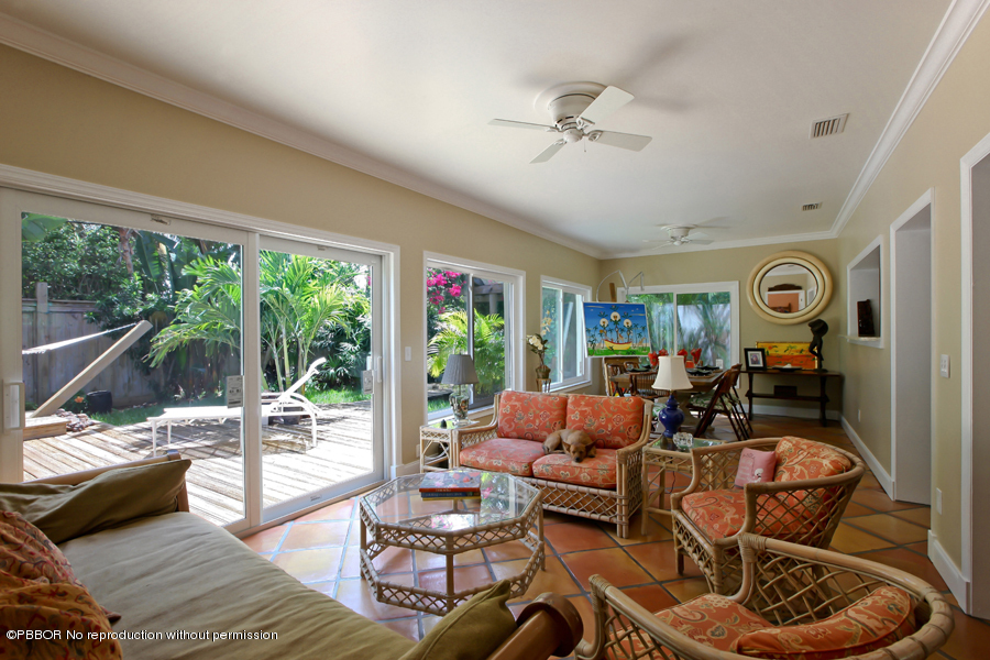 130 Alpine Road West Palm Beach, FL 33405 - Photo 5 of 14 a living room with furniture and a floor to ceiling window