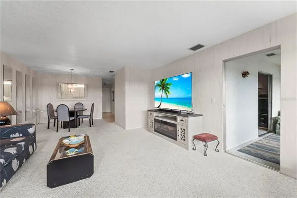a kitchen with a sink and refrigerator