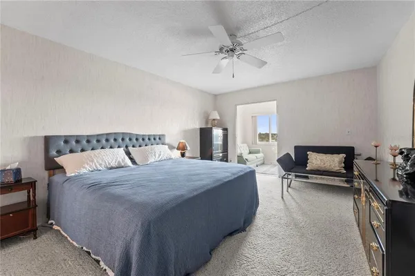 a bedroom with a bed and a table