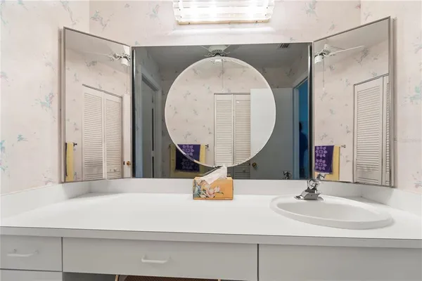 a bathroom with a sink and a mirror
