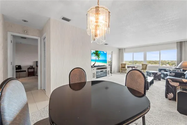 a kitchen with stainless steel appliances a stove a sink and a microwave