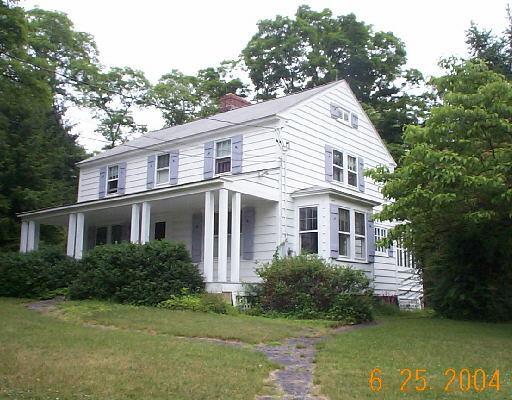 109 Sunny Valley Road New Milford, CT 06776 - Photo 1 of 1 a view of a white house next to a yard with big trees