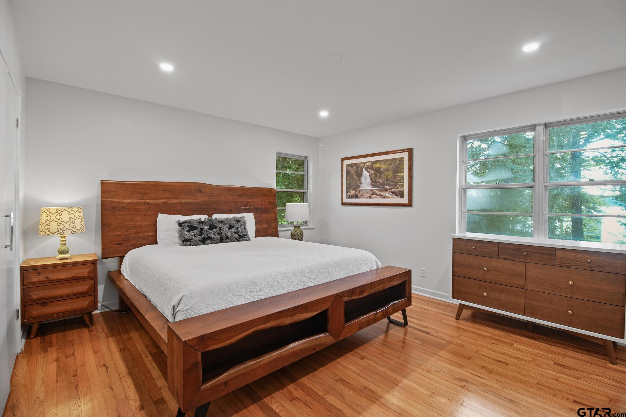 18392 Eastside Road Troup, TX 75789 - Photo 11 of 19 a bed sitting in a bedroom next to a window