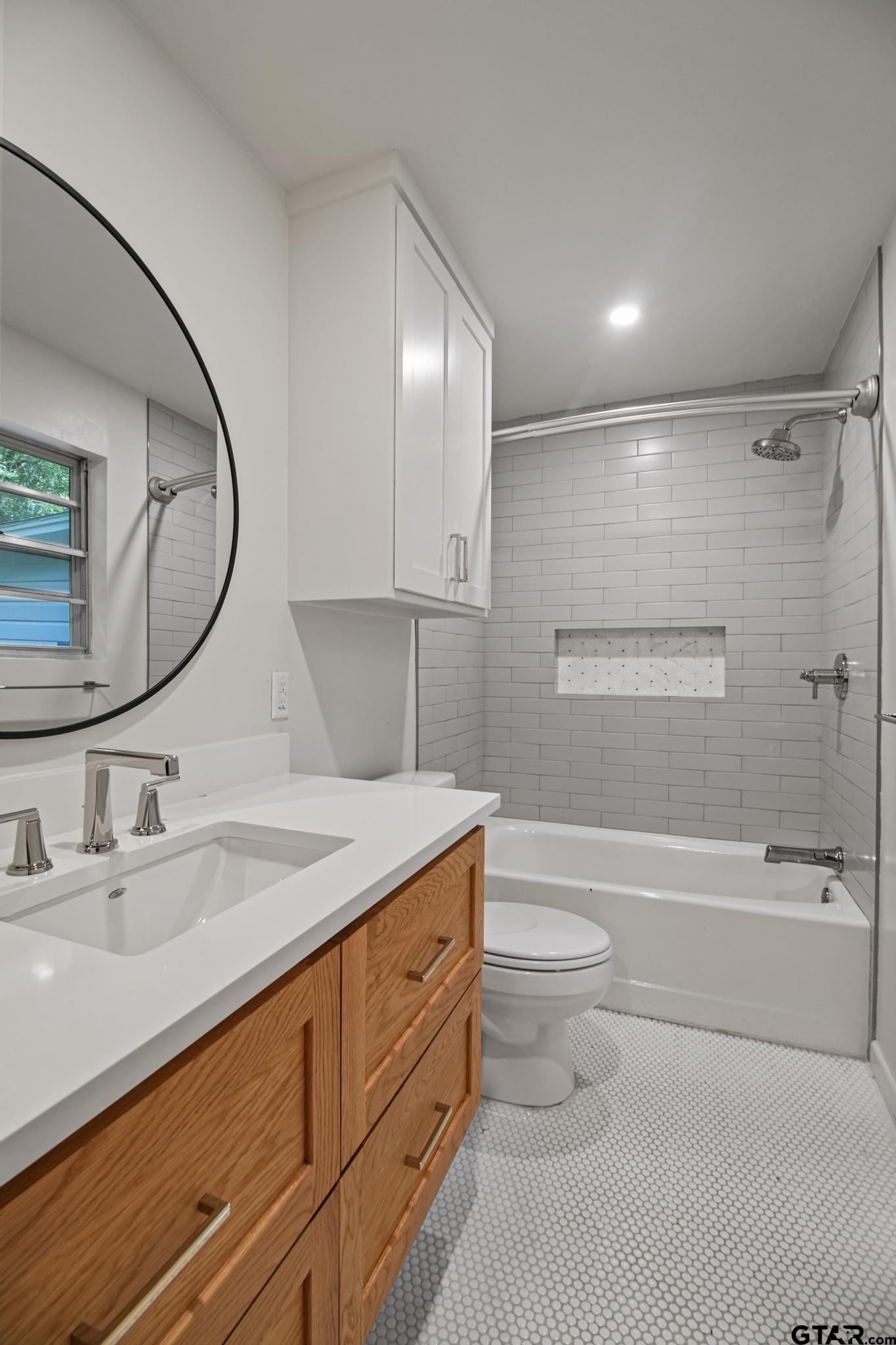 18392 Eastside Road Troup, TX 75789 - Photo 14 of 19 a bathroom with a sink a toilet and a mirror