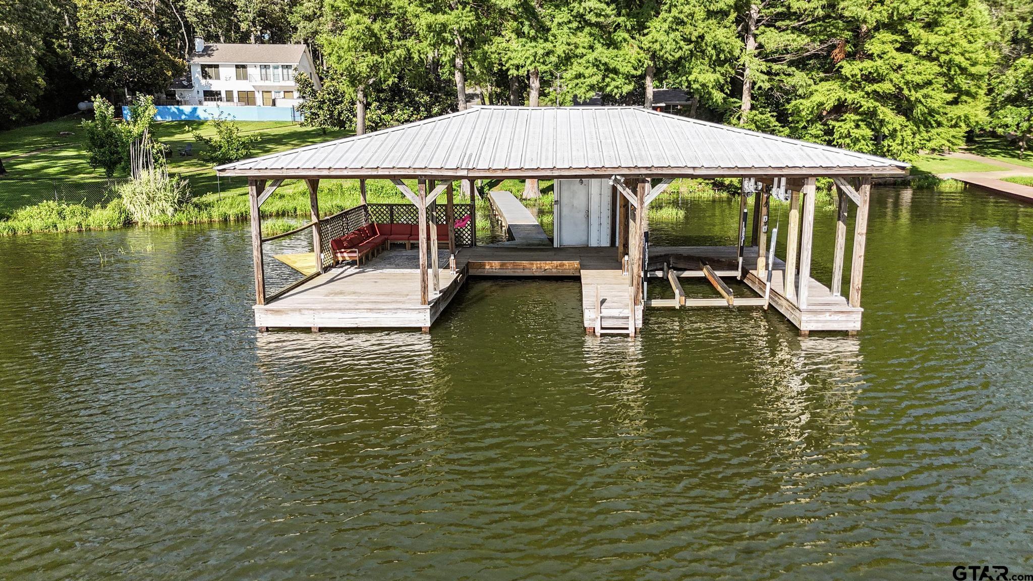 18392 Eastside Road Troup, TX 75789 - Photo 15 of 19 a view of pool with lawn chairs under an umbrella